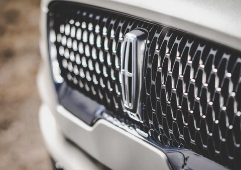 The grille of the 2024 Lincoln Aviator® Reserve model with an eye-catching repeated field of Lincoln Star logo shapes | West Point Lincoln of Sugar Land in Houston TX