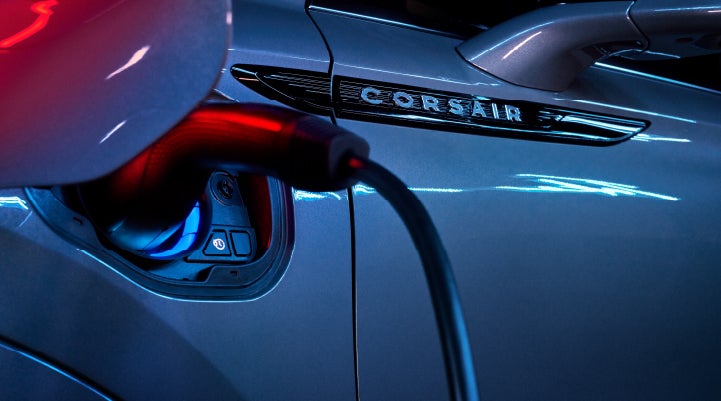 A charger plugged into the charging port of a 2024 Lincoln Corsair® Plug-in Hybrid model. | West Point Lincoln of Sugar Land in Houston TX