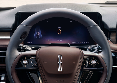 The steering wheel of 2025 Lincoln Aviator® SUV is shown with black and brown accents. | West Point Lincoln of Sugar Land in Houston TX