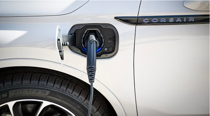 An electric charger is shown plugged into the charging port of a Lincoln Corsair® Grand Touring
model. | West Point Lincoln of Sugar Land in Houston TX