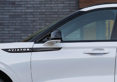 The driver’s side door and fender badging of a white 2026 Lincoln Aviator® SUV are showcased. | West Point Lincoln of Sugar Land in Houston TX