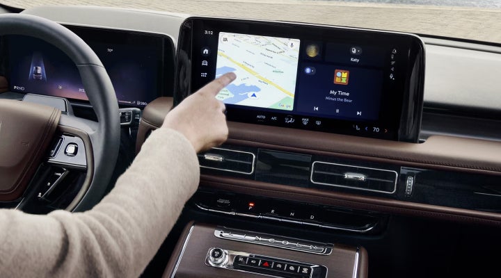 A person is tapping the center display touchscreen of a 2026 Lincoln Aviator® SUV. | West Point Lincoln of Sugar Land in Houston TX