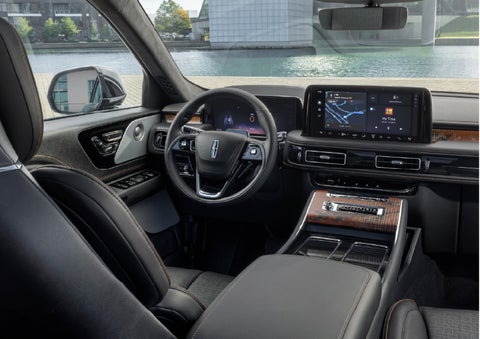 The interior of the 2026 Lincoln Aviator® SUV is shown parked with a view of a harbor through the windshield. | West Point Lincoln of Sugar Land in Houston TX