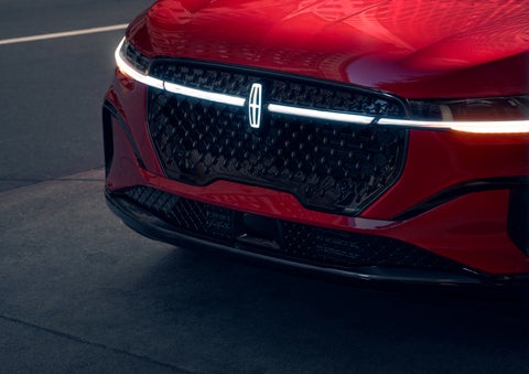 The available front LED light bar and center Lincoln Star logo glow at dusk. | West Point Lincoln of Sugar Land in Houston TX