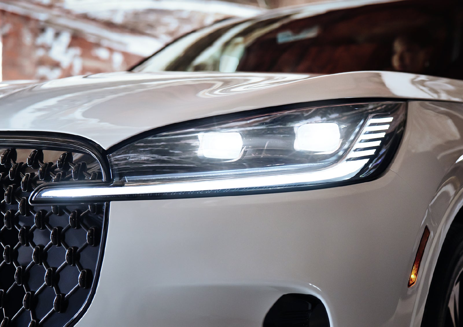 A close-up of a headlamp on the 2027 Lincoln Aviator® SUV is shown. | West Point Lincoln of Sugar Land in Houston TX
