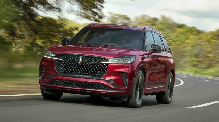 A 2027 Lincoln Aviator® SUV is being driven on a country road | West Point Lincoln of Sugar Land in Houston TX